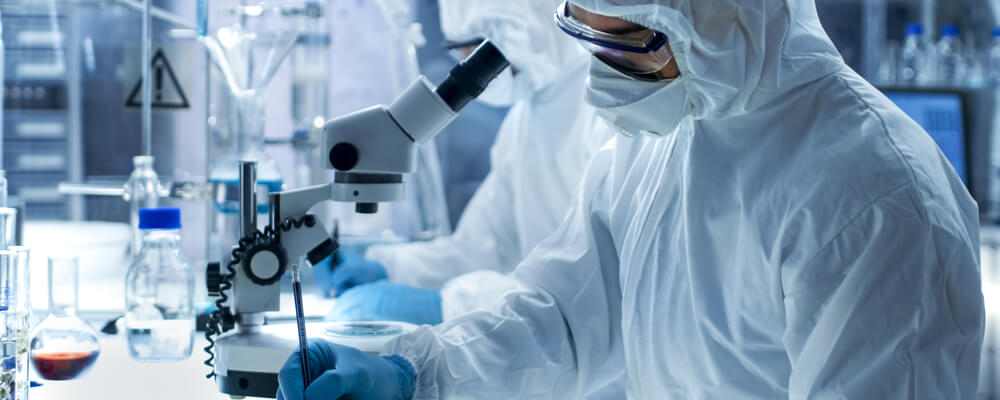 Laboratory Scientists in a Coverall Conducting a Research